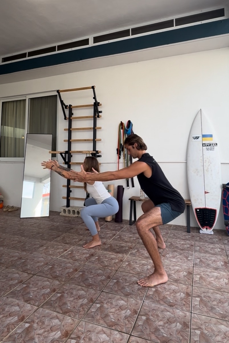 Mark Poli coaching a client through movement work